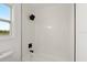Modern bathroom featuring shower and window with a view to the outside at 3813 Long Grove Ln, Port Orange, FL 32129