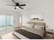 Calm bedroom features wood floors, sliding doors and decor, with ample natural light at 3813 Long Grove Ln, Port Orange, FL 32129