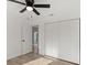 Bedroom featuring a ceiling fan and closet, offering ample storage and comfort at 3813 Long Grove Ln, Port Orange, FL 32129