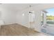 Bright bedroom with modern flooring and sliding glass doors to the outside at 3813 Long Grove Ln, Port Orange, FL 32129