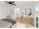Bright bedroom features modern decor, wood floors and sliding doors to the outside at 3813 Long Grove Ln, Port Orange, FL 32129