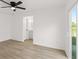 Bedroom featuring a ceiling fan and sliding glass doors leading to the outdoors at 3813 Long Grove Ln, Port Orange, FL 32129