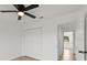 This bedroom features wood flooring and a closet with double doors at 3813 Long Grove Ln, Port Orange, FL 32129