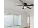 Bedroom displaying a modern ceiling fan and sliding doors to the patio at 3813 Long Grove Ln, Port Orange, FL 32129