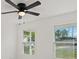 Bright bedroom with natural light, enhanced by a modern ceiling fan at 3813 Long Grove Ln, Port Orange, FL 32129