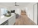 Spacious living area features wood floors, modern lighting, and an open layout at 3813 Long Grove Ln, Port Orange, FL 32129