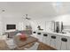 Bright open-concept living area with modern kitchen, breakfast bar, and comfortable seating at 3813 Long Grove Ln, Port Orange, FL 32129