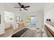 Bright main bedroom features modern decor, wood floors and sliding doors to the outside at 3813 Long Grove Ln, Port Orange, FL 32129
