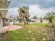 Backyard featuring a brick patio, a fenced yard, and a shed at 412 Cherry St, South Daytona, FL 32119