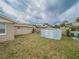 Fenced backyard with large storage shed at 412 Cherry St, South Daytona, FL 32119