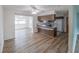 Open-concept kitchen with white appliances and breakfast bar, perfect for casual dining at 412 Cherry St, South Daytona, FL 32119