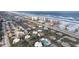 Scenic aerial view of the neighborhood, highlighting the nearby beach, coastal and residential buildings at 4150 S Atlantic Ave # 104 B, New Smyrna Beach, FL 32169