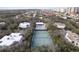 Expansive property featuring a tennis court, pool, lush greenery, and proximity to the ocean at 4150 S Atlantic Ave # 104 B, New Smyrna Beach, FL 32169