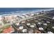 Breathtaking aerial view capturing the coastline, nearby building and the serene ocean at 4150 S Atlantic Ave # 104 B, New Smyrna Beach, FL 32169