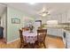 Bright breakfast nook with a view and white appliances at 4150 S Atlantic Ave # 104 B, New Smyrna Beach, FL 32169