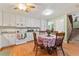 Bright kitchen with a breakfast nook and a view of the stairs at 4150 S Atlantic Ave # 104 B, New Smyrna Beach, FL 32169