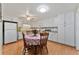 Cozy kitchen with white cabinets and a breakfast nook at 4150 S Atlantic Ave # 104 B, New Smyrna Beach, FL 32169