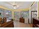 Bright sunroom with multiple windows and tile flooring at 4150 S Atlantic Ave # 104 B, New Smyrna Beach, FL 32169