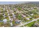 Residential community captured from above, highlighting proximity to a large lake and surrounding greenery at 445 Virginia Ave, St Cloud, FL 34769