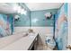 Stylish bathroom featuring modern lighting, an expansive vanity, and a shower with glass doors at 445 Virginia Ave, St Cloud, FL 34769