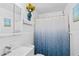 Bathroom featuring decorative sunflower-themed decor, a shower with curtain and vanity at 445 Virginia Ave, St Cloud, FL 34769