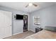 Bedroom with a TV on wall, closet and window overlooking a pool at 445 Virginia Ave, St Cloud, FL 34769