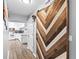 Hallway leading to the kitchen with a sliding wood door feature at 445 Virginia Ave, St Cloud, FL 34769