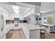Bright kitchen boasts white cabinetry, sleek countertops, and stainless steel appliances at 445 Virginia Ave, St Cloud, FL 34769