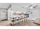 Spacious kitchen with island seating, stainless steel appliances, and wooden cabinets at 445 Virginia Ave, St Cloud, FL 34769