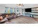 Living room showcasing wood accent wall, neutral paint, and an entertainment center at 445 Virginia Ave, St Cloud, FL 34769