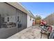 View of the screened lanai, backyard and a workshop area from the private patio at 445 Virginia Ave, St Cloud, FL 34769