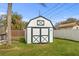 Well-maintained backyard shed with painted doors, offering outdoor storage at 445 Virginia Ave, St Cloud, FL 34769