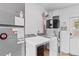 Utility room features washer, dryer, and water heater at 445 Virginia Ave, St Cloud, FL 34769