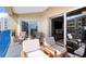 Inviting balcony with chairs, showcasing a seamless transition between indoor and outdoor living spaces at 5300 S Atlantic Ave # 8-404, New Smyrna Beach, FL 32169