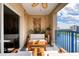 Charming balcony featuring cozy seating, plants, and views of the lake and community at 5300 S Atlantic Ave # 8-404, New Smyrna Beach, FL 32169