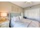 Bedroom showcasing a bed, bedside table, wardrobe, and stylish wall decor at 5300 S Atlantic Ave # 8-404, New Smyrna Beach, FL 32169
