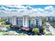 Exterior view showcasing the building's design, parking area, and landscaping at 5300 S Atlantic Ave # 8-404, New Smyrna Beach, FL 32169