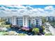 Exterior view showcasing the building's design, parking area, and landscaping at 5300 S Atlantic Ave # 8-404, New Smyrna Beach, FL 32169