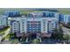 Exterior view of a condo building featuring multiple stories and well maintained landscaping at 5300 S Atlantic Ave # 8-404, New Smyrna Beach, FL 32169