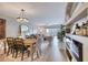 Living area open concept featuring hardwood floors, natural light, and dining area view at 5300 S Atlantic Ave # 8-404, New Smyrna Beach, FL 32169