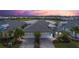 Beautiful aerial view of the home with a spacious driveway and lush landscaping at 583 Lost Shaker Way, Daytona Beach, FL 32124