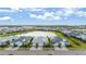 Beautiful aerial view showcasing homes near a serene lake, under a partly cloudy sky at 583 Lost Shaker Way, Daytona Beach, FL 32124