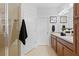 Bathroom with a glass enclosed shower, double vanity, and tile flooring at 583 Lost Shaker Way, Daytona Beach, FL 32124