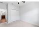 A bedroom features a ceiling fan, closet, and doorway to the ensuite bathroom at 583 Lost Shaker Way, Daytona Beach, FL 32124