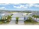 Stunning exterior elevation with a grey roof, landscaped yard, and a three-car garage at 583 Lost Shaker Way, Daytona Beach, FL 32124