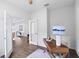 Home office featuring modern desk and chair, neutral walls, and double doors at 583 Lost Shaker Way, Daytona Beach, FL 32124