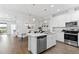 Modern kitchen with granite counters, stainless steel appliances, and eat in dining area at 583 Lost Shaker Way, Daytona Beach, FL 32124