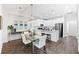 Eat in kitchen with white cabinetry, granite counters, and stainless steel appliances at 583 Lost Shaker Way, Daytona Beach, FL 32124