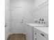 Laundry room with a side-by-side washer and dryer and wire shelving at 583 Lost Shaker Way, Daytona Beach, FL 32124