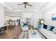Bright living room with tile floors, tray ceilings, and an open layout to the kitchen at 583 Lost Shaker Way, Daytona Beach, FL 32124